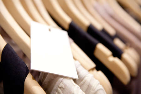 Clothes hang on a shelf in a designer clothes store in Melbourne, Australiaの写真素材