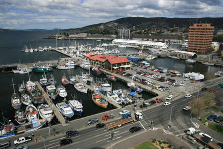 View over the waterfront of Hobart and fishing boats in Hobart, Tasmania, Australiaの写真素材