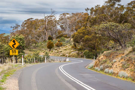 A rural winding road near Bothwell in Tasmania, Australiaの写真素材