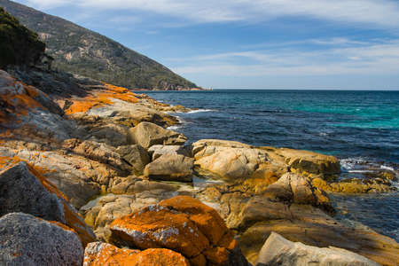 A beach in a remote part of the Freycinet Peninsula in Tasmaniaの写真素材