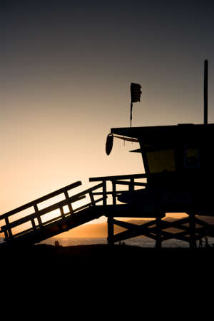 Sunset thru a lifeguard tower near Santa Monica in Los Angeles, USAの写真素材