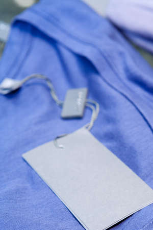 A womens top with label on a shelf in a designer clothes store in Melbourne, Australiaの写真素材