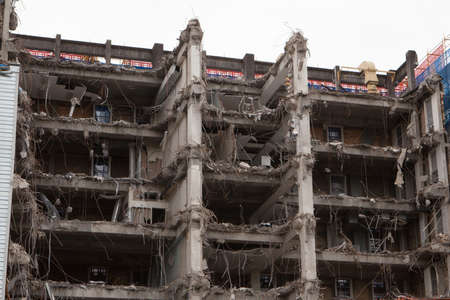 A building is half way thru demolition leaving exposed internalsの写真素材