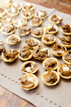 A mushroom based canape is served at a cocktail partyの写真素材