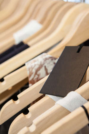 Clothes hang on a shelf in a designer clothes store in Melbourne, Australiaの写真素材