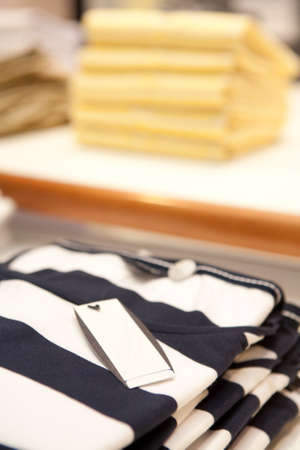 Clothes sit on a shelf in a designer clothes store in Melbourne, Australiaの写真素材