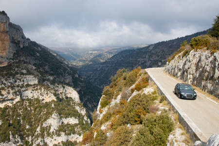A car makes its way around winding roads in Provence, Franceの写真素材