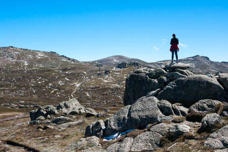 A spectacular view across the valley on the Kosciuszko walk at the summit of Thredo looking towards Mount Kosciusko, in the Snowy Mountains, New South Wales, Australiaの写真素材