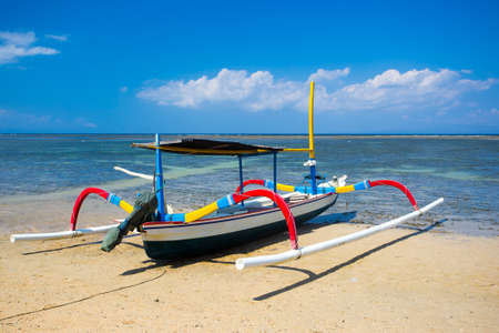 Traditional Balinese boat on a Sanur beach in Bali, Indonesiaの写真素材