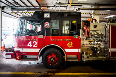 Chicago, USA - August 14, 2015: Chicago Metropolitan fire trucks sits inside a fire station in downtown Chicagoのeditorial素材