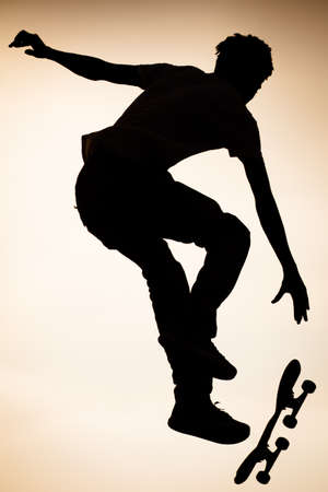 A skateboarder in action at Venice Beach Skate Park in Los Angeles, California, USAの写真素材