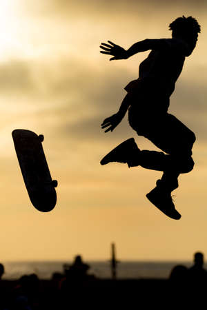 A skateboarder in action at Venice Beach Skate Park in Los Angeles, California, USA