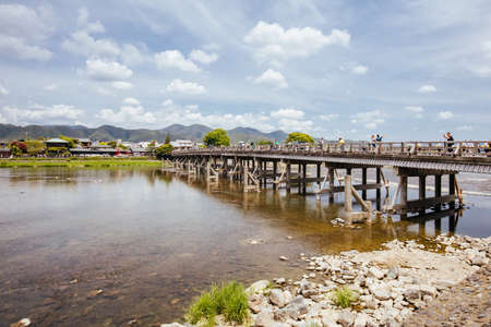 The Togetsu Bridge crossing over the Katsura River in Arashiyama District in Kyoto, Japanの写真素材