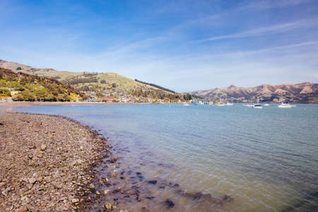Beach and water in the French settlement of Akaroa on Banks Peninsula in New Zealand