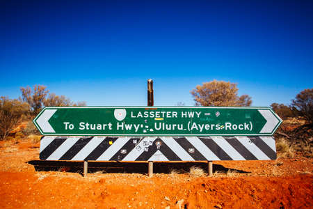 Uluru Road Sign in Outback Australiaの写真素材