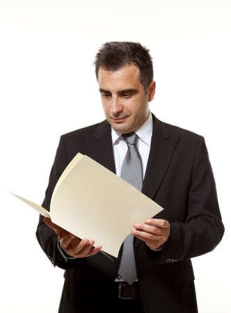 Businessman reads a document with queryの写真素材
