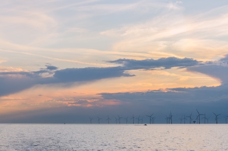 Wind farm generators at sea before stormの写真素材