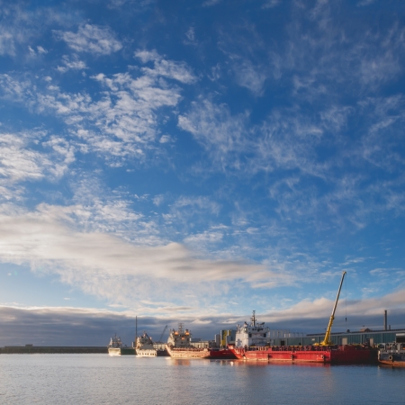 Oil platform supply vessels in a port during sunriseの写真素材