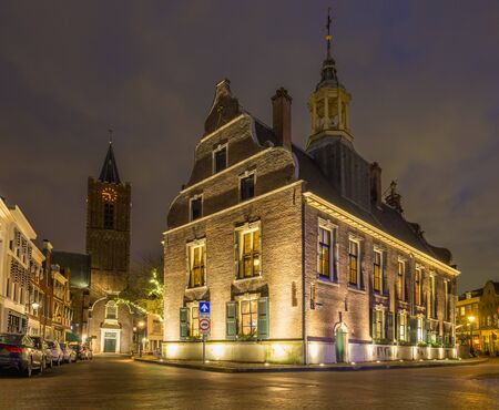 Dutch old city Schiedam town hall and church in the eveningの写真素材