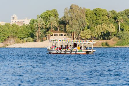 Luxor, Egypt - January 16, 2020 : Motor boat with tourists on the Nile River in Egyptのeditorial素材
