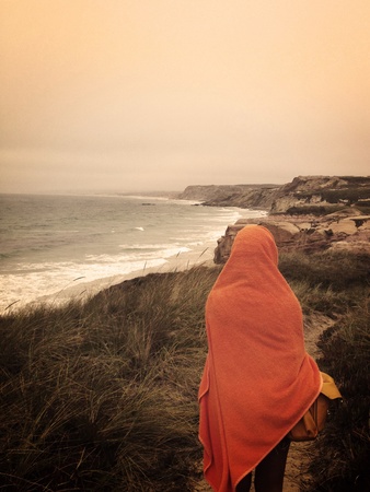 Lonely girl watching the beach viewの素材