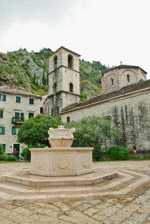 Montenegro Kotor church, fountain in the center one of old city buildingsの写真素材