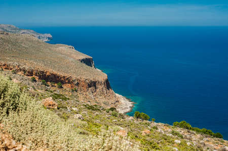 Sea coast, turquoise water and rocky hill. Road to Balos, Crete, Greeceの写真素材