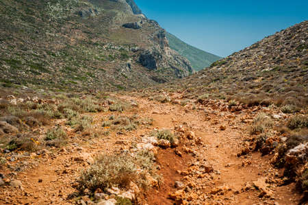 Sea coast, turquoise water and rocky hill. Road to Balos, Crete, Greeceの写真素材