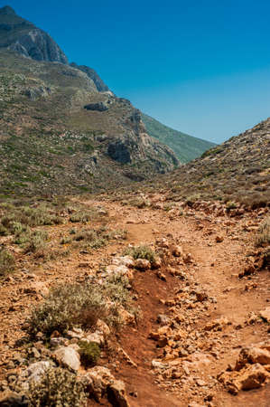 Sea coast, turquoise water and rocky hill. Road to Balos, Crete, Greeceの写真素材