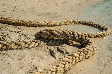 Rope on sand, Calm picture, ship lineの写真素材