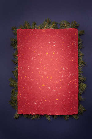 Hand made red christmas paper with tree border with tree