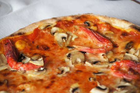 Appetizing pizza with mushrooms and shrimp / detailの写真素材