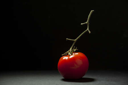 tomato on black backgroundの写真素材