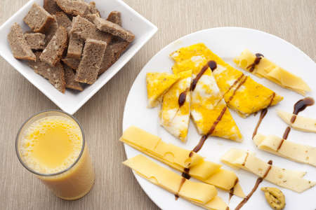 Pieces of bread with omelette and cheeseの写真素材