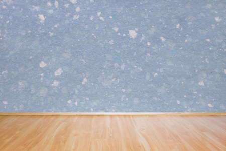 Blue handmade wall texture and wooden floor