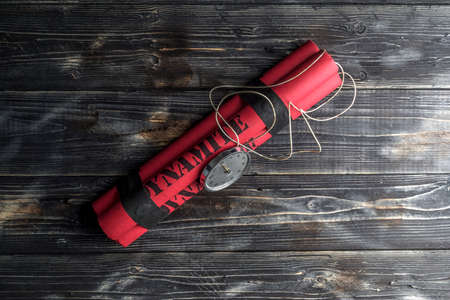 Dynamite bomb with a timer, and a bunch of dynamite on black background. Dynamite is going to explode in 1 second.の写真素材