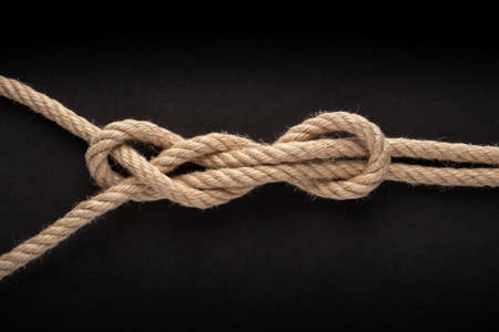Sheet Bend Double isolate on black background. Rope node.