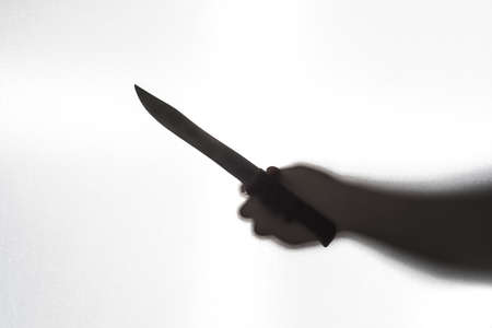 silhouette of the murder with knife. Fear concept.