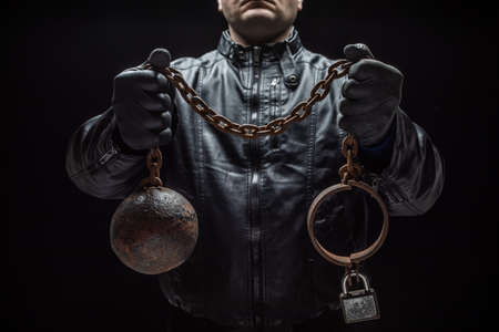 Serial killer with chains for his victim / Halloween conceptの写真素材