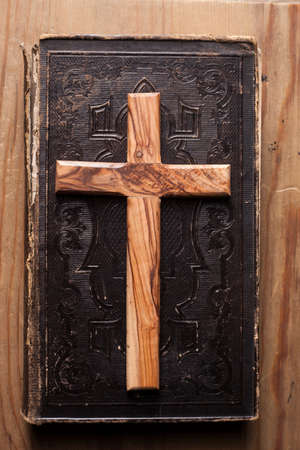 Old holy bible with wooden Christian crossの写真素材