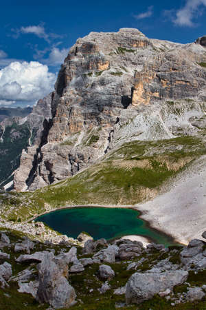 View of the Dolomites mountains with a colorful turquoise alpine lakeの写真素材