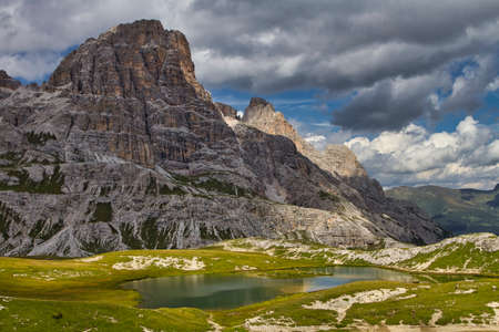 View of the Dolomites mountains with a colorful turquoise alpine lakeの写真素材