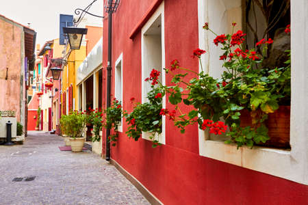 Among the colorful alleys of Caorle cityの写真素材