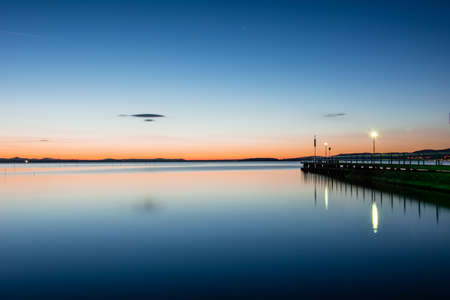 Blue hour sunset at the lake (Umbria)の写真素材