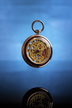 old pocket watch suspended in timeの写真素材