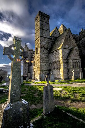 Cross on Rock of Cashel with cloudy background in Irelandの写真素材