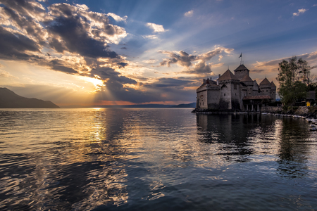 Chillon Castle on the shores of Lake Geneva at dramatic sunsetのeditorial素材