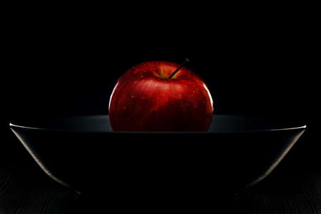 Red Apple on a Black Plateの写真素材