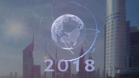 2018 text with 3d hologram of the planet Earth against the backdrop of the modern metropolis....