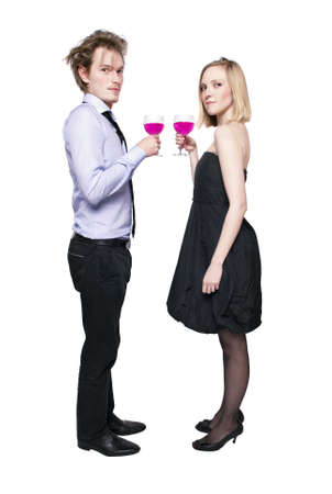 Young couple toasting with pink drink. Two people drinking. の写真素材